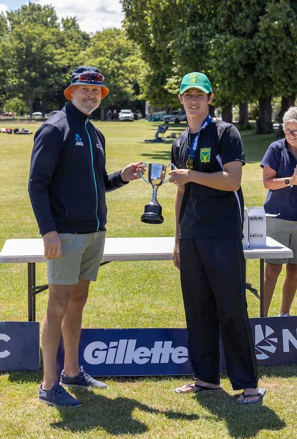 Paul Wiseman presents Central Districts Captain Curtis Heaphy with the winning trophy for the U19 Gillette Cup mens tournament played in the Canterbury District, pictured at the Christs College Sports Fields in Hagley Park, Christchurch. 21st January 2022.
Copyright photo: Peter Meecham / www.photosport.nz