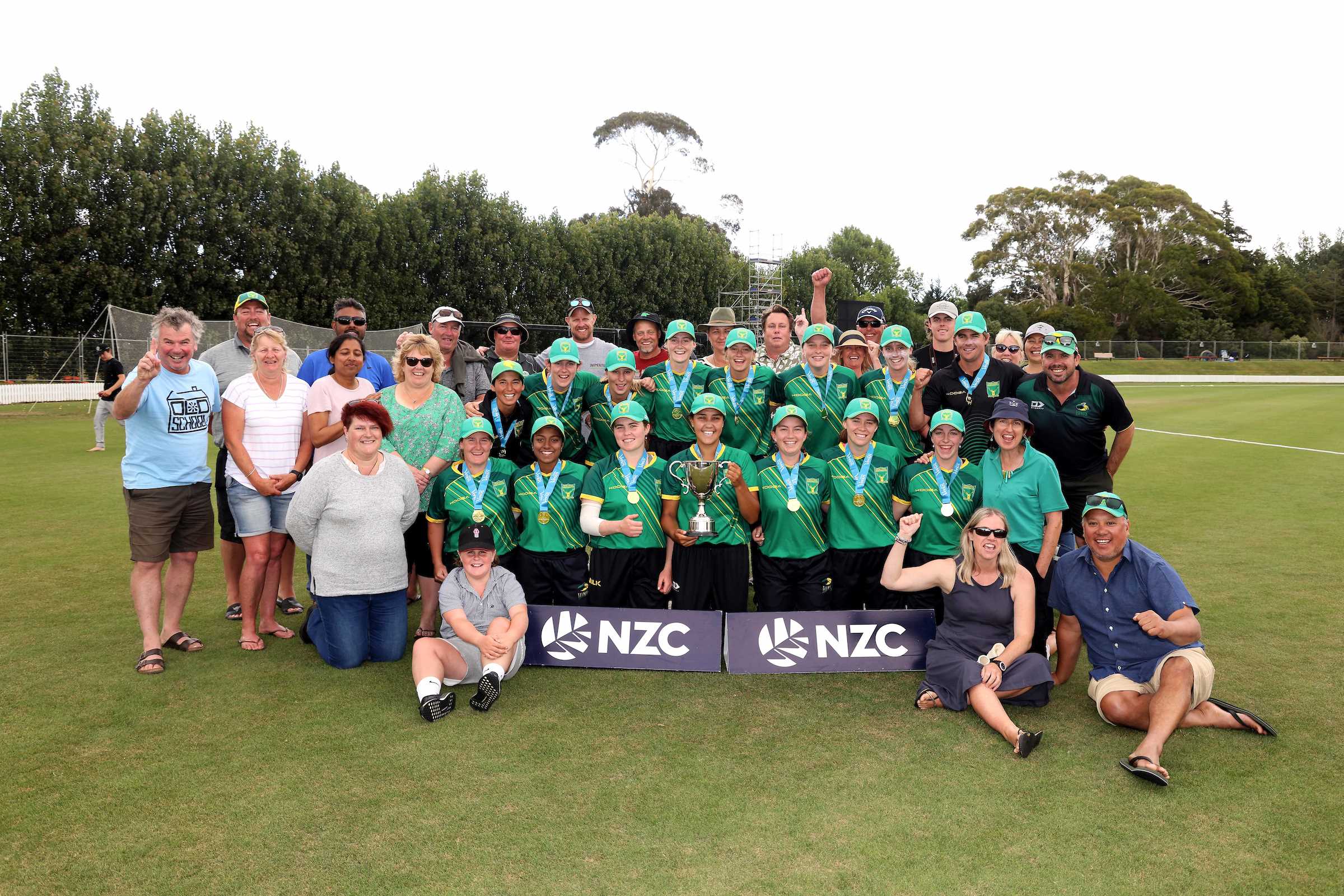 Central Districts players and familes celebrate with the trophy after winning the Gillette Venus Women’s Under-19 National Tournament, Lincoln, Christchurch, New Zealand, Wednesday 12 January 2022. Photo: Martin Hunter/Photosport
