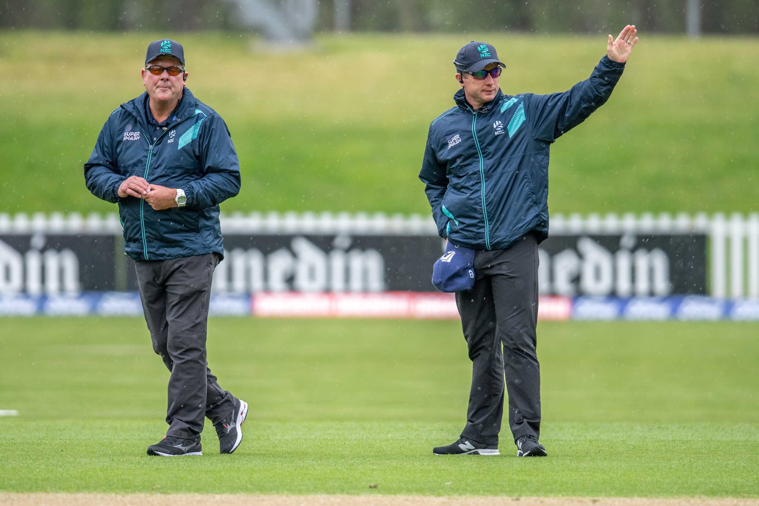 Umpires Derek Walker and Shaun Haig call the covers on during the Dream11 Super Smash T20 cricket match, Otago Volts v Auckland Aces at University of Otago Oval, Dunedin on the 19th December 2019
Copyright photo: Steve McArthur / www.photosport.nz